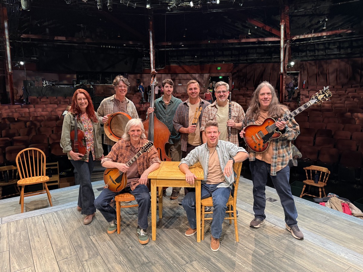Come From Away pit orchestra on stage at North Shore Music Theatre with fiddle, bodhr&aacute;n, upright bass, mandolin, ugly stick, flute and guitar